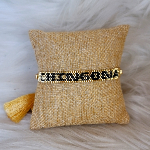 Jewelry - SEED BEAD ADJUSTABLE BRACLET WITH TASSELS.